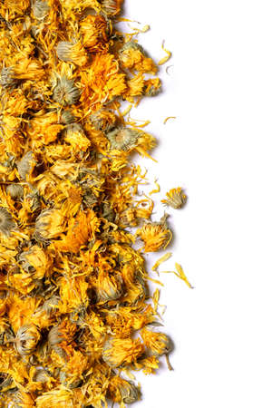Medicinal flowers of a calendula on white background. herbal tea. top view. close up. high resolutionの写真素材