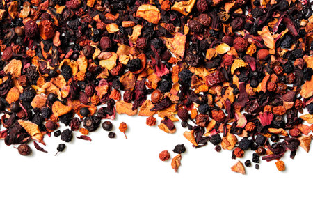 Mix of fruit pieces, berries and Sudanese rose petals(karkade) on white background. top view. close up. high resolutionの写真素材