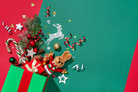 Holiday explosion from gift box on green background. Merry Christmas and Happy New Year conceptの写真素材