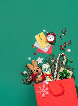 Holiday explosion from shopping bag on green background. Merry Christmas and Happy New Year conceptの写真素材