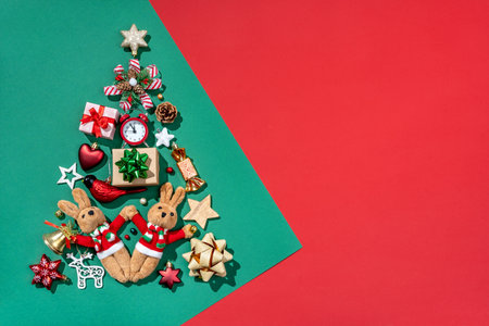 Silhouette of Christmas tree made of toys on green background. Merry Christmas and Happy New Year conceptの写真素材