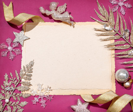 Christmas letter with shiny branches and decoration toys on pink background. Merry Christmas and Happy New Year concept. Copy space for your text. top viewの写真素材