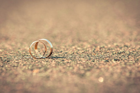 wedding rings. Wedding rings on the pavement.の写真素材