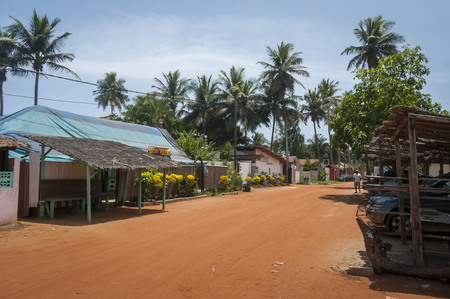 A street of an African village in the Ivory Coast stock image. Assouinde, Ivory Coast, Africa, April 2013.のeditorial素材