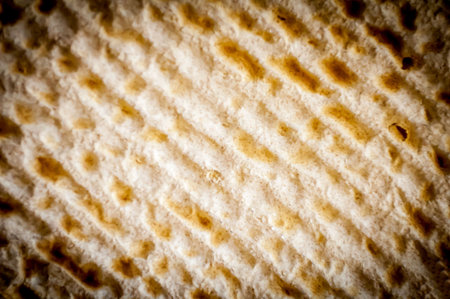 Jewish traditional Matso unleavened bread textured background, matso bread is made during the Jewish...