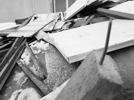 nails and old boards in a pile of construction waste after repair