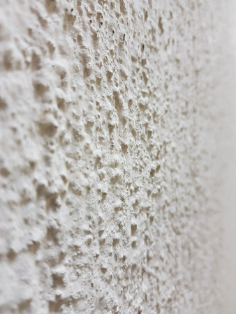 beautiful texture of embossed decorative plaster on the wallの写真素材