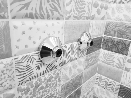 Repair and plumbing - reflectors for water tap on a tileの写真素材