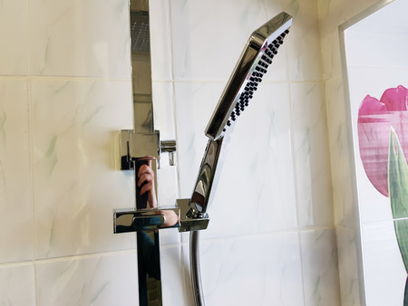 Plumbing, building and repair - shower in the bathroom on a chrome pipeの写真素材