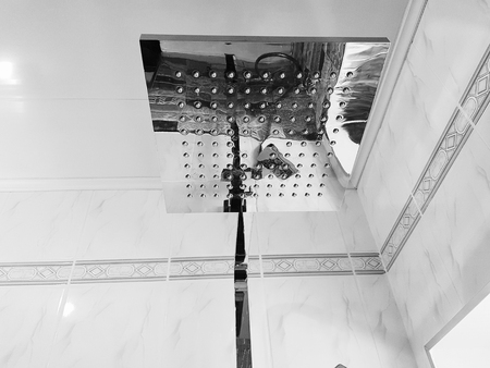 Plumbing, building and repair - shower in the bathroom on a chrome pipeの写真素材