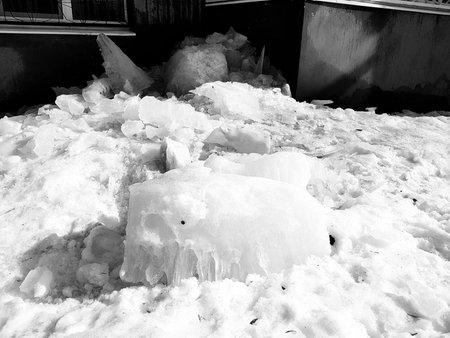 A dangerous large ice block fell from a roof in winter or spring