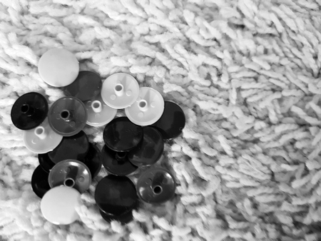 Beautiful furniture fittings - various fasteners and hardware lie on a light wooden texture with furniture plugsの写真素材