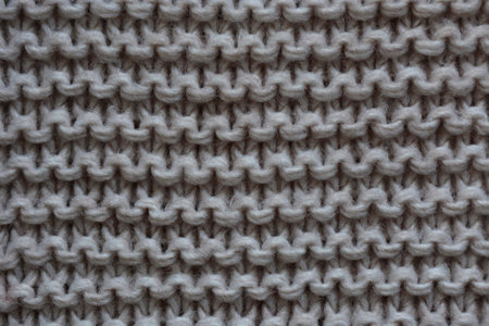 Selective focus background. Hand-made pattern. Knitted texture.