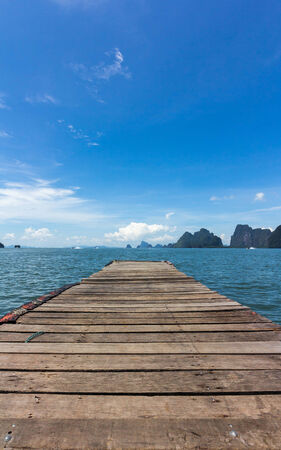 Wooden bridge stretching into the sea, Thailandの写真素材