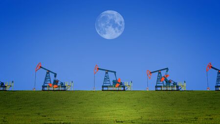 3 of the machine in producing oil field in the sky with the moonの写真素材