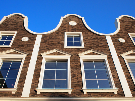 View from the bottom to the upper floors of a modern building, built in an old European styleの写真素材