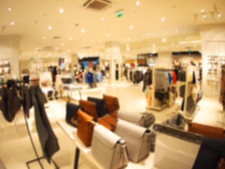 Blurred and defocused view of the female shop with women's bags and clothing with wide angle fisheye lens and distortion view for use as a backgroundの写真素材