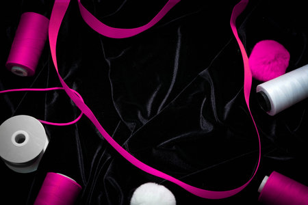 background threads, ribbons on a black , pink, Magentaの写真素材