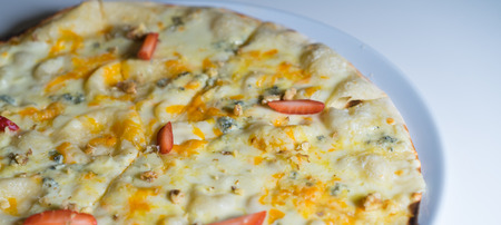 cheese pizza on a plate with strawberriesの写真素材