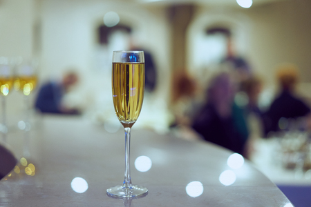 a glass of champagne on the background of the holidayの写真素材