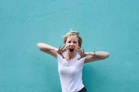 girl on a blue background shouts