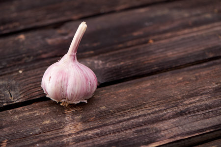garlic on black wooden background