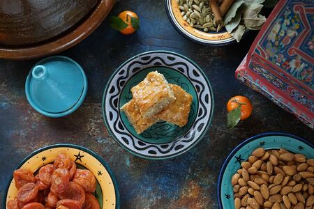 Baklava a traditional Arabic dessert with walnuts and honey on an Oriental tableの写真素材