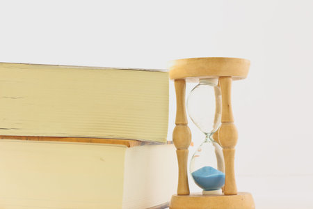 hourglass with book
