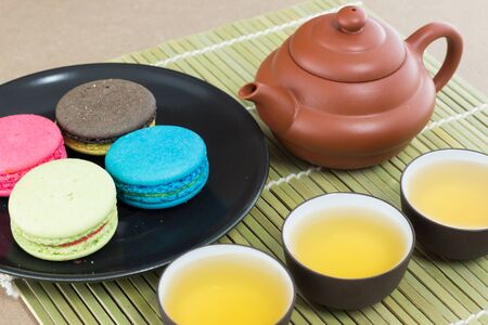 Teapot and macaroon dessertの写真素材