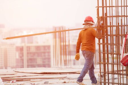 Worker bring steel in site constructionの写真素材