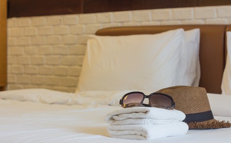 hat travel and basket  on the bedの写真素材