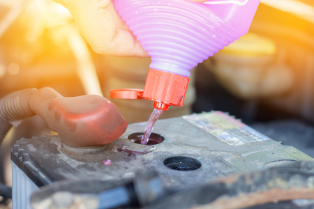 Fill distilled water in the batteryの写真素材