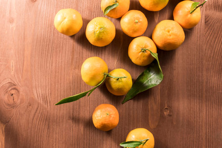 Fresh clementine on wood brown rustic tableの写真素材