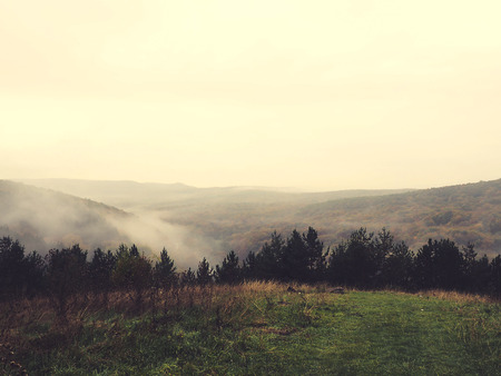 Misty autumn morning mountainの写真素材