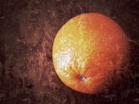 orange on on wood tableの写真素材