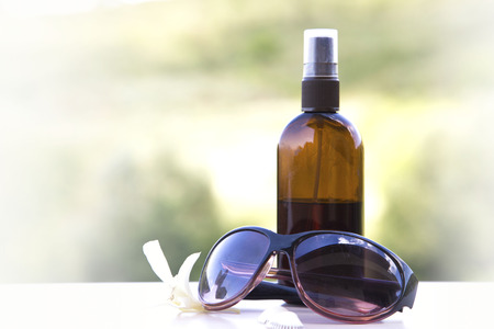 Sun lotion and sunglassesの写真素材