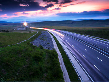 light trails on motorway highway at night, long exposure abstractの写真素材