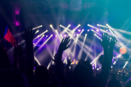 crowd, happy people enjoying rock concert, raised up hands