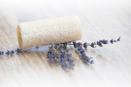 Lavender and sponge on wooden background