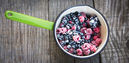 Summer food, frozen raspberry in a bowlの写真素材