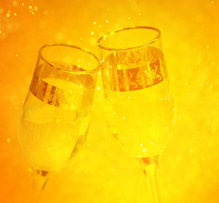 Champagne glasses and midnight clock. Happy New Yearの写真素材