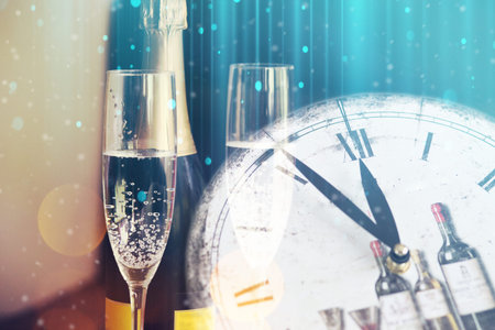 Champagne glasses and midnight clock. Happy New Year