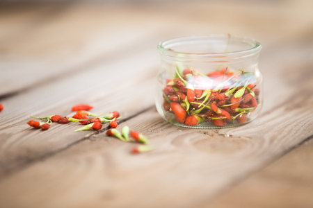 Goji fruits on wooden backgroundの写真素材