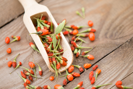 Goji fruits on wooden backgroundの写真素材