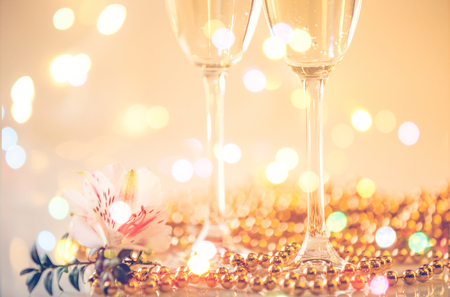 New Year Champagne glasses and fireworks backgroundの写真素材