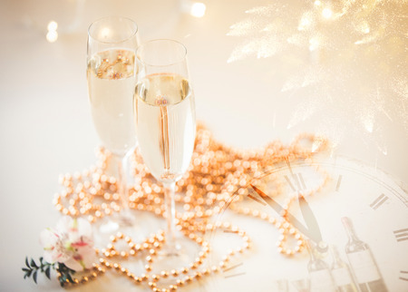 New Year Champagne glasses and fireworks backgroundの写真素材