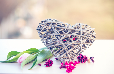 Pink tulips on rustic wooden table romantic backgroundの写真素材