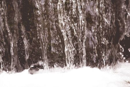 Fresh mountain waterfall backgroundの写真素材