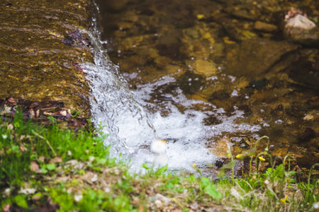 Refreshing summer mountain waterfall background