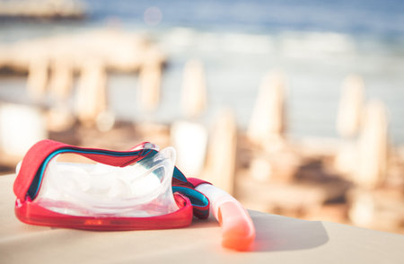 Snorkeling mask and tube on tropical beach